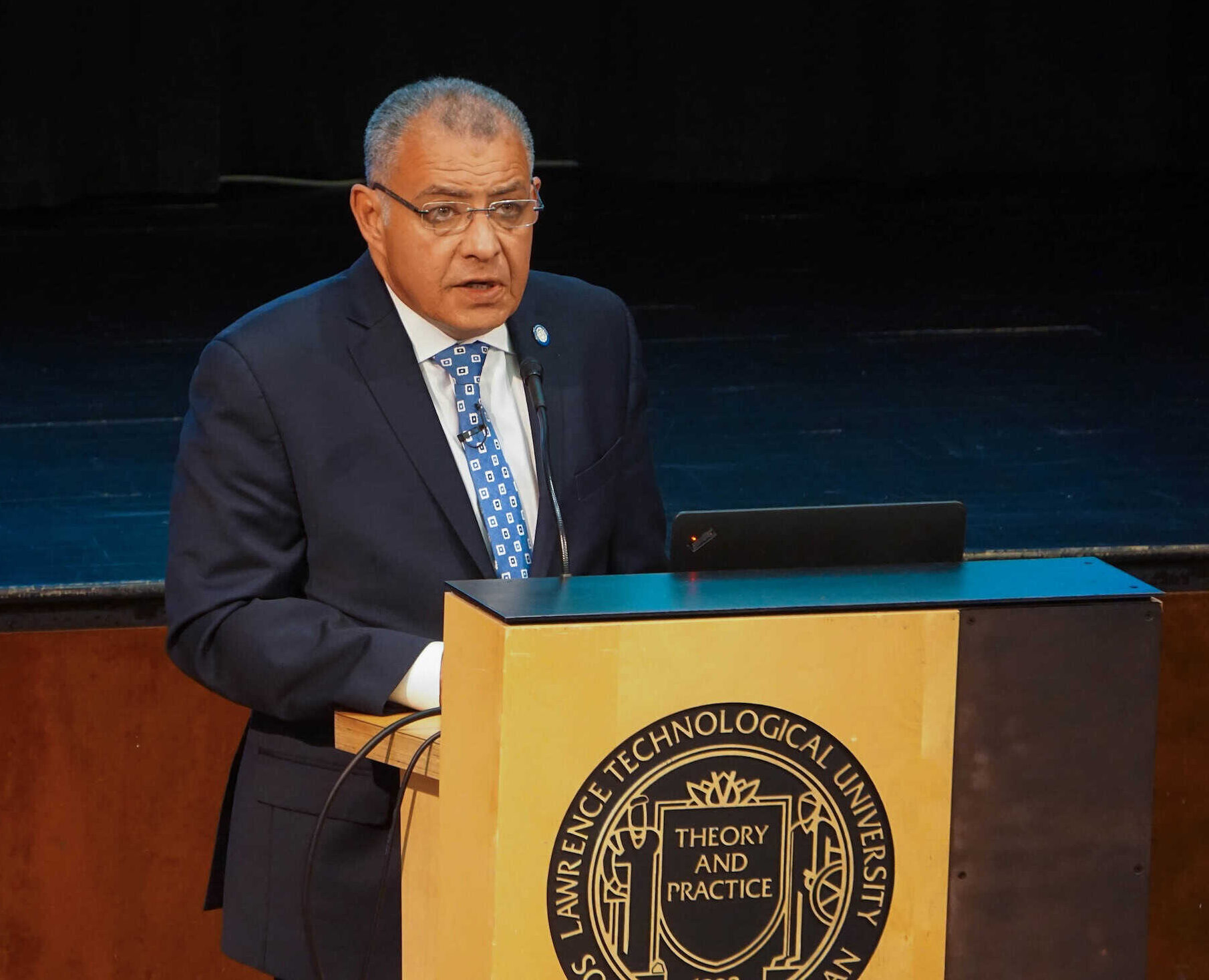 Professor Tarek M. Sobh speaking at a university event on engineering and innovation.